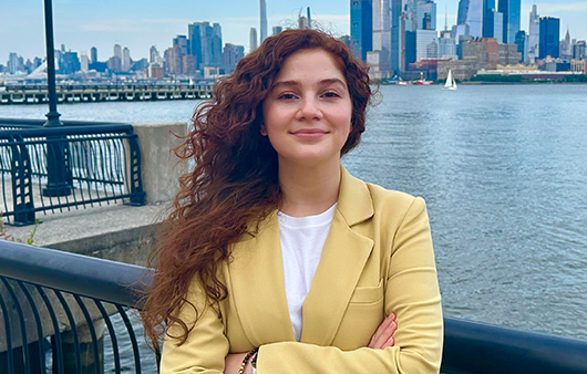 Tamara Seredneva with New York City skyline in the background